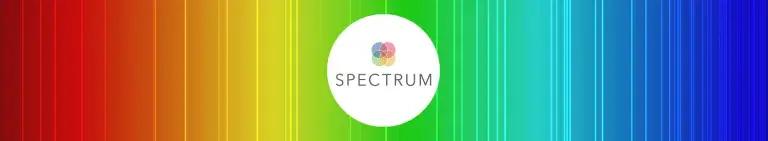 Decorative image. Rainbow-style background with a circular SPECTRUM logo in the middle.