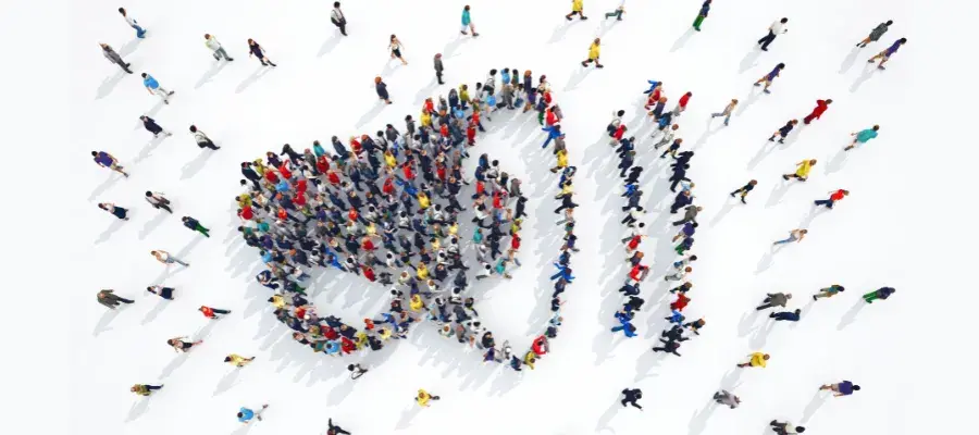 Group of people in shape of a megaphone