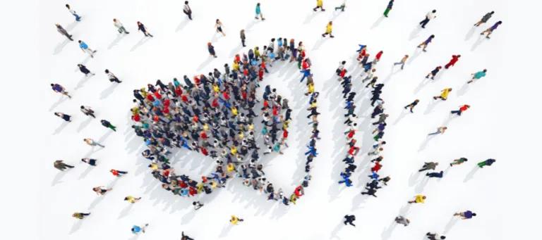 Group of people in shape of a megaphone